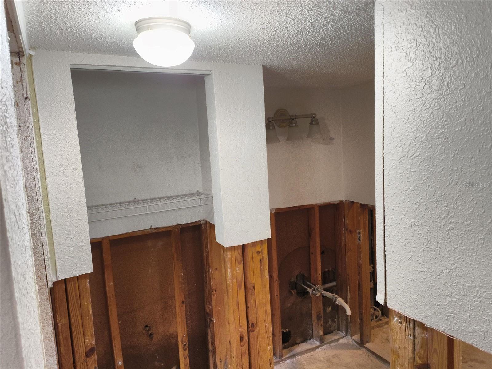 2nd bathroom with linen closet and a nice-sized space for a vanity