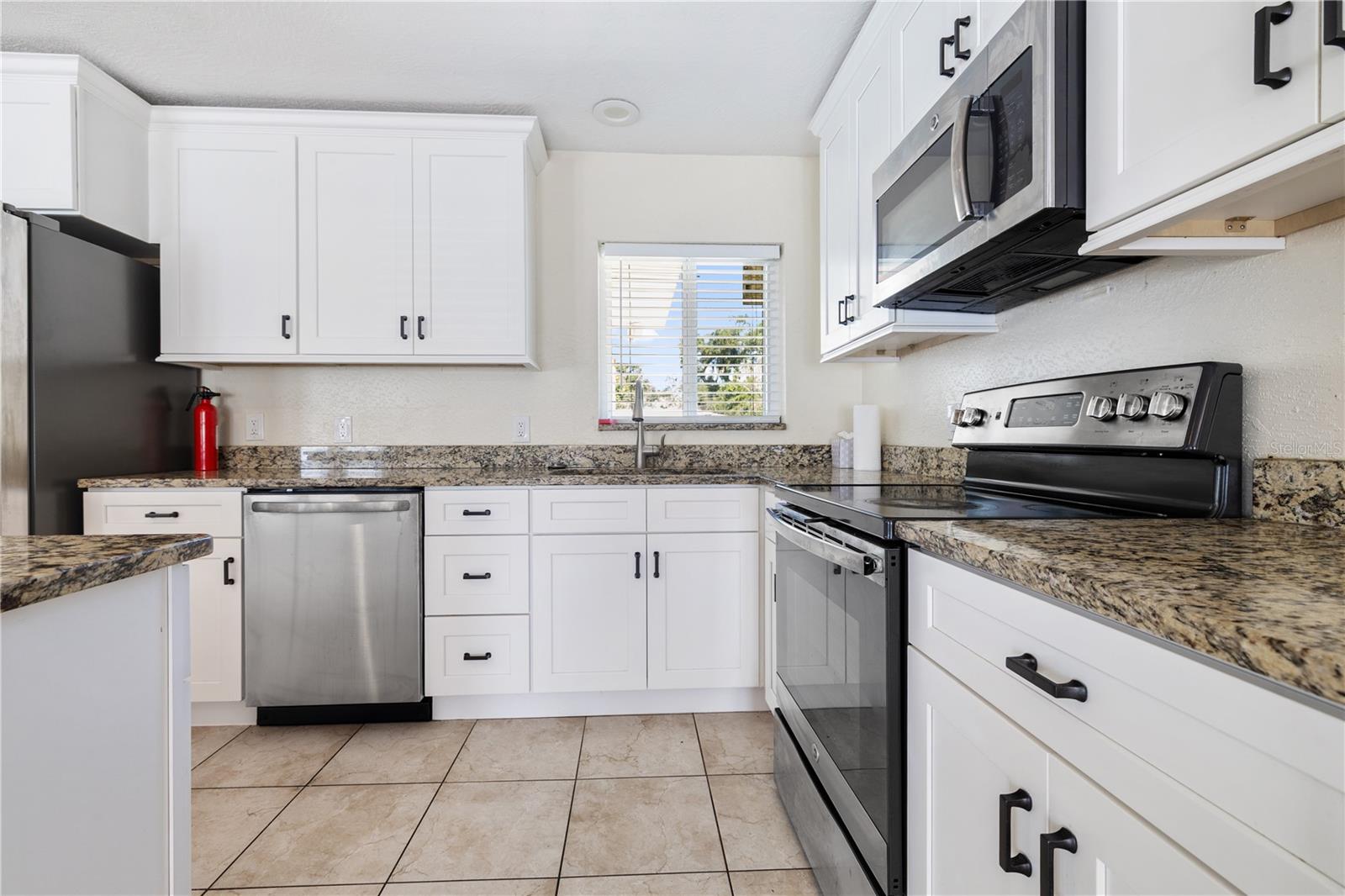 Updated Kitchen with Granite Countertops and Stainless Steel Appliances.