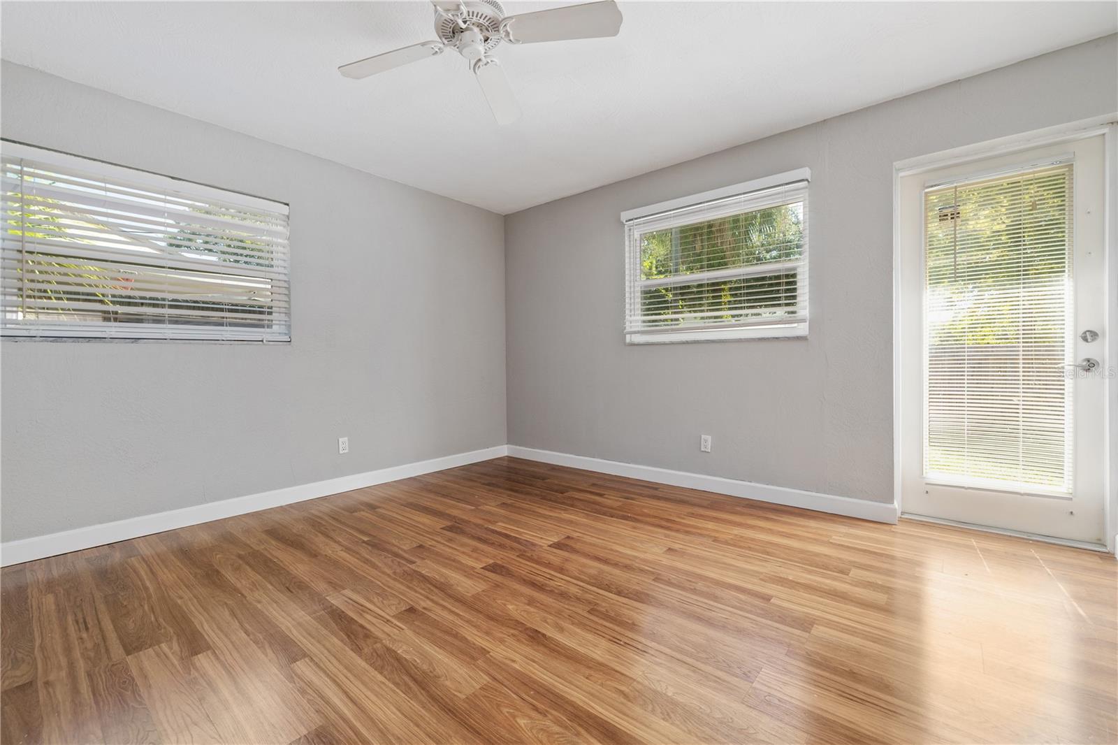 Primary Bedroom with door leading to backyard