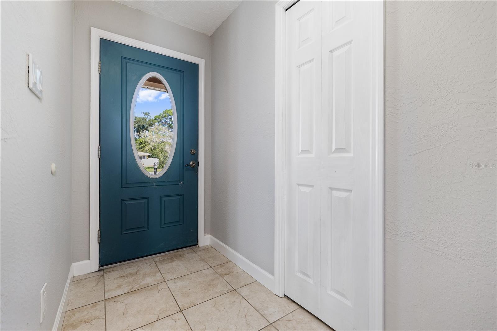 Foyer with coat closet.