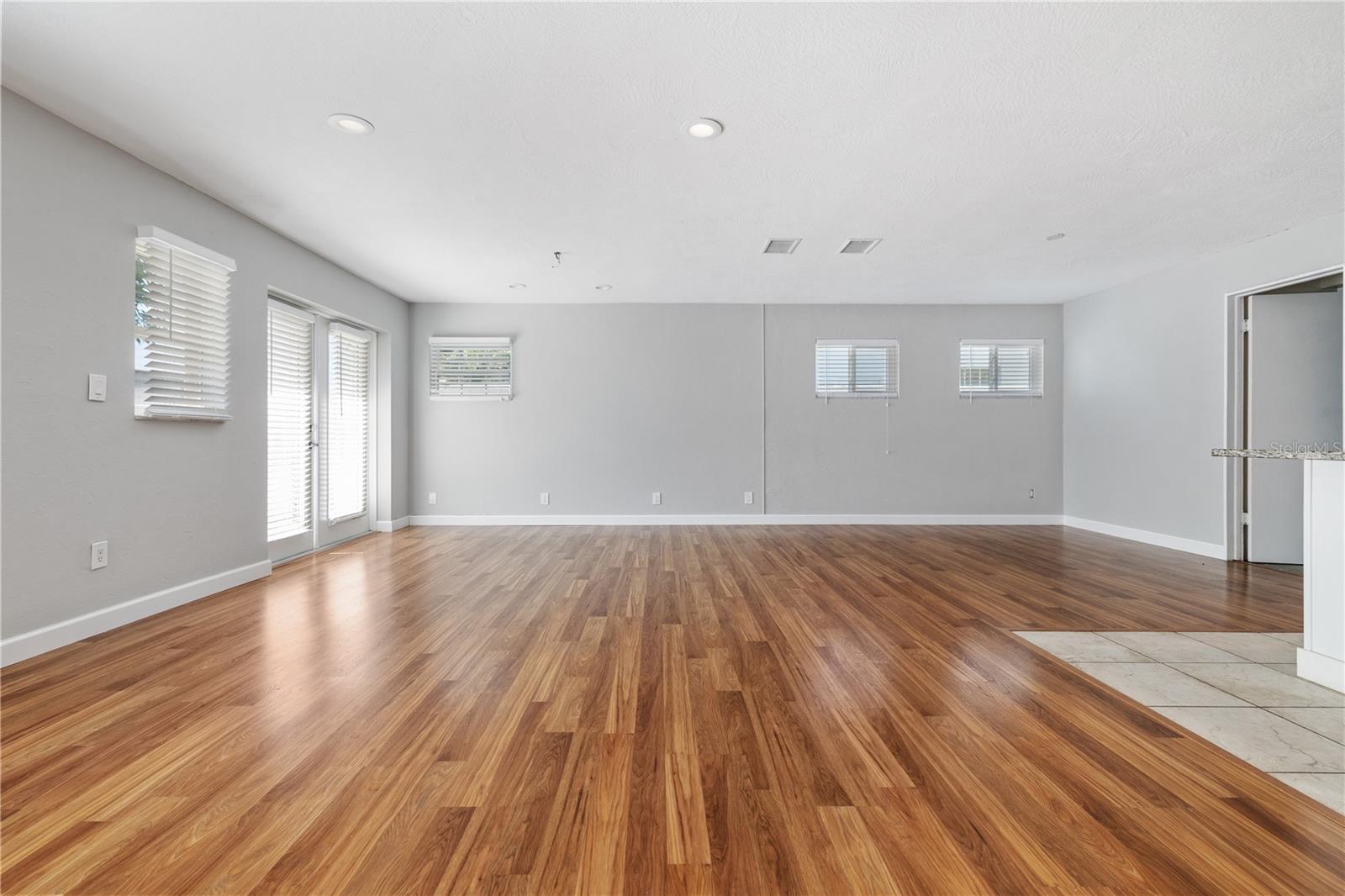 Laminate wood floors throughout and French Doors.