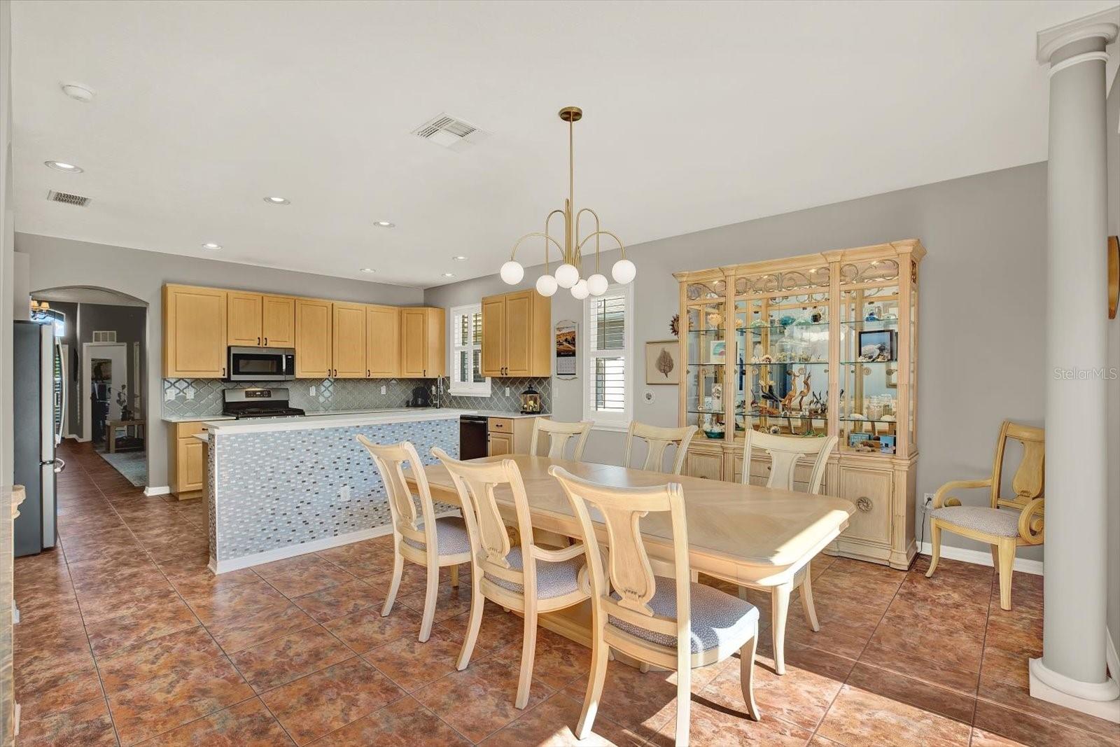 Gather, dine, and make memories—this open dining space is perfect for family dinners, holidays, or brunch with friends overlooking the pool.