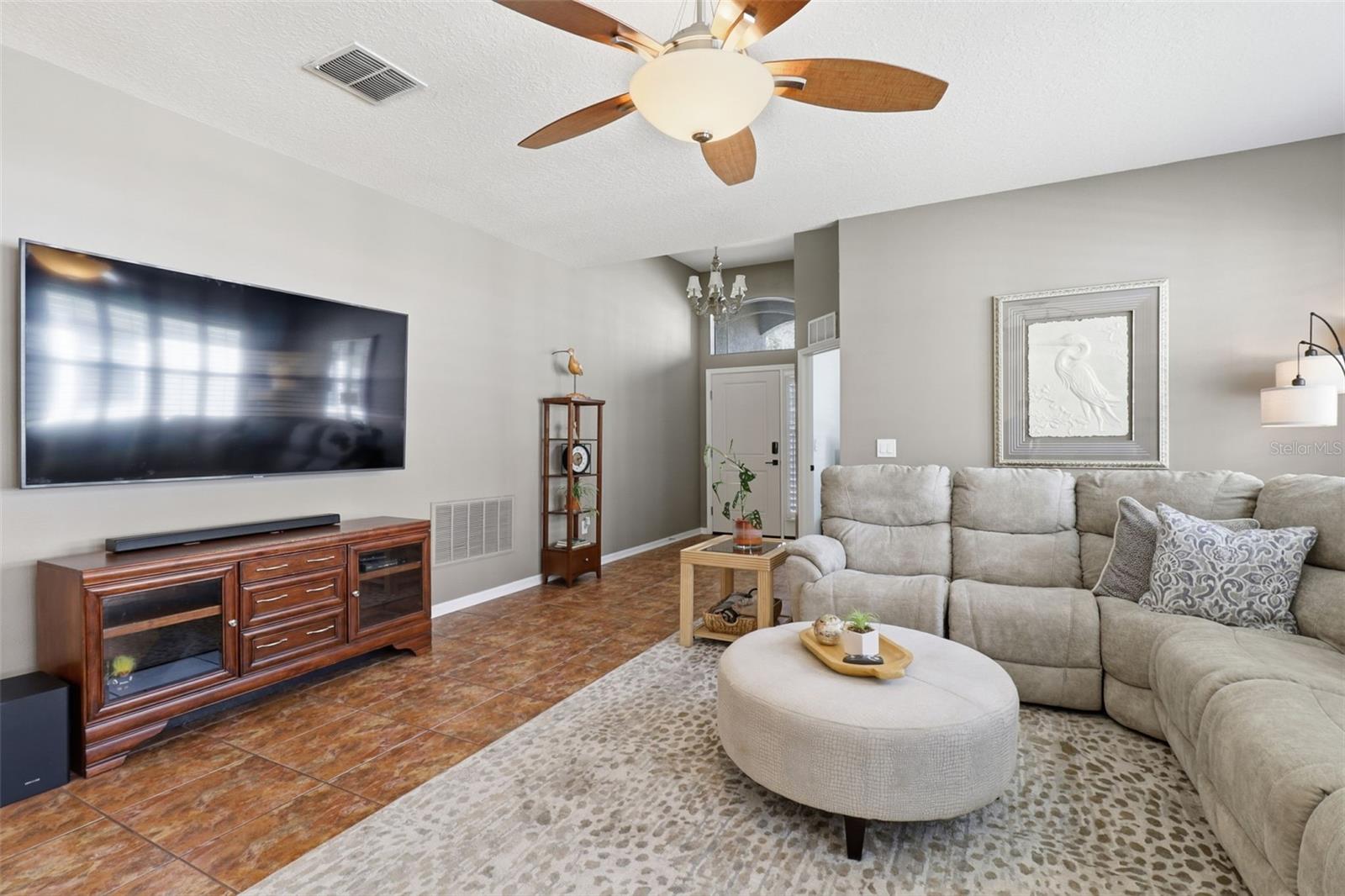 Cozy up for movie night in this spacious living room—plenty of room for your favorite sectional and big-screen entertainment setup!