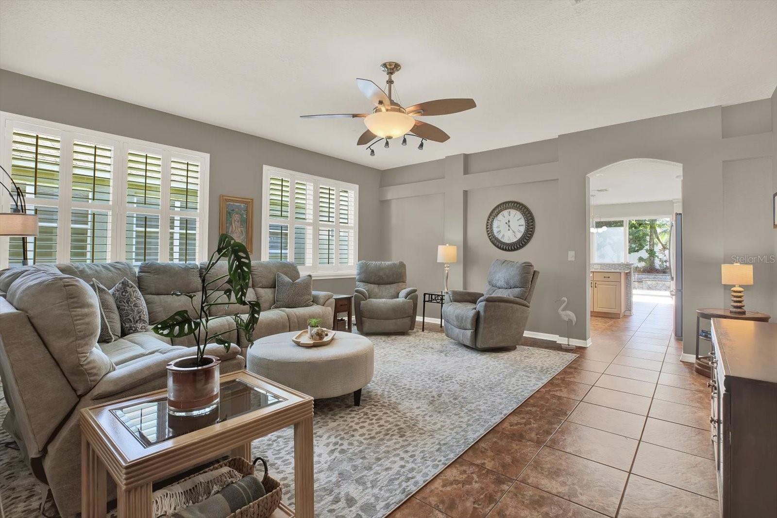 Bright and welcoming living room with oak hardwood floors, tons of natural light, and plenty of space to relax or entertain in style.