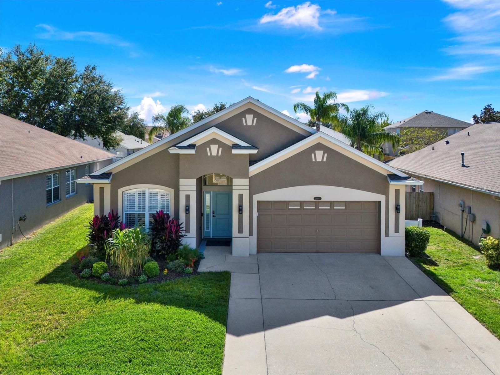 Beautifully maintained home with great curb appeal, tropical landscaping, and a welcoming front entry—located on a quiet cul-de-sac right outside of Wesley Chapel, in Lutz..