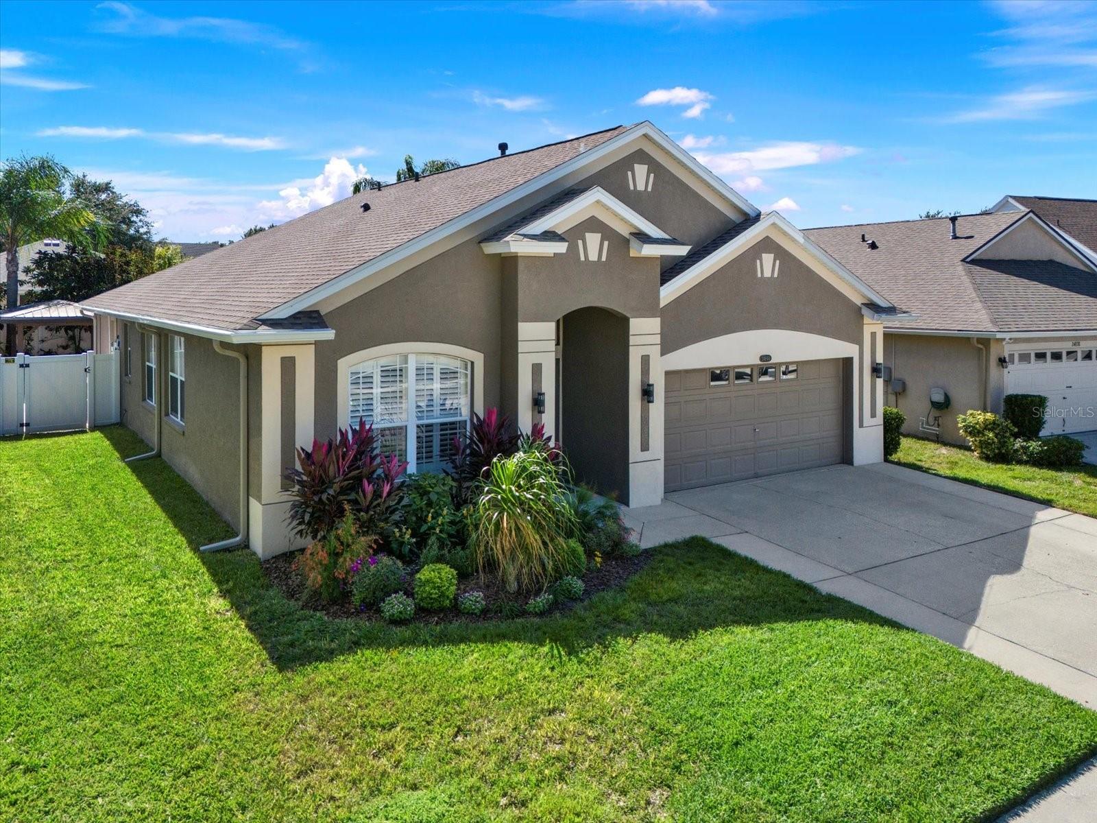 Beautifully maintained Lutz home with 2023 roof, tropical landscaping, and inviting curb appeal—nestled on a quiet cul-de-sac close to everything!