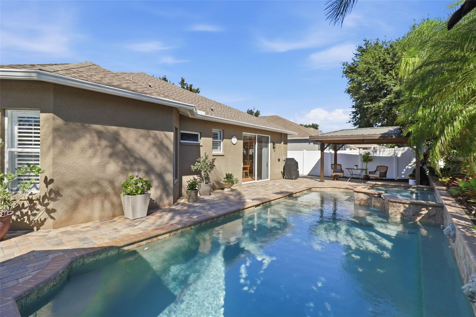 Jump right in—this sparkling saltwater pool and spa bring resort living home! Every day feels like vacation right in your own backyard.