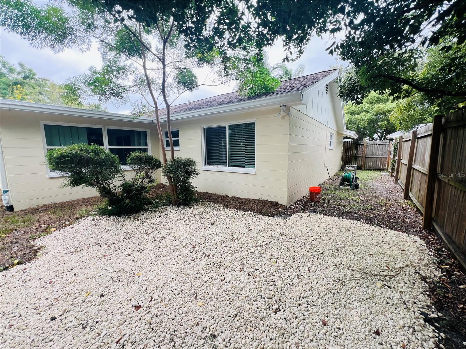 BACK YARD AND SEEING SIDE OF PROPERTY