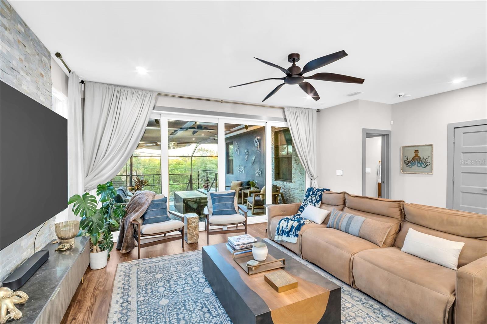 Four panel sliding glass doors that completely slide away.