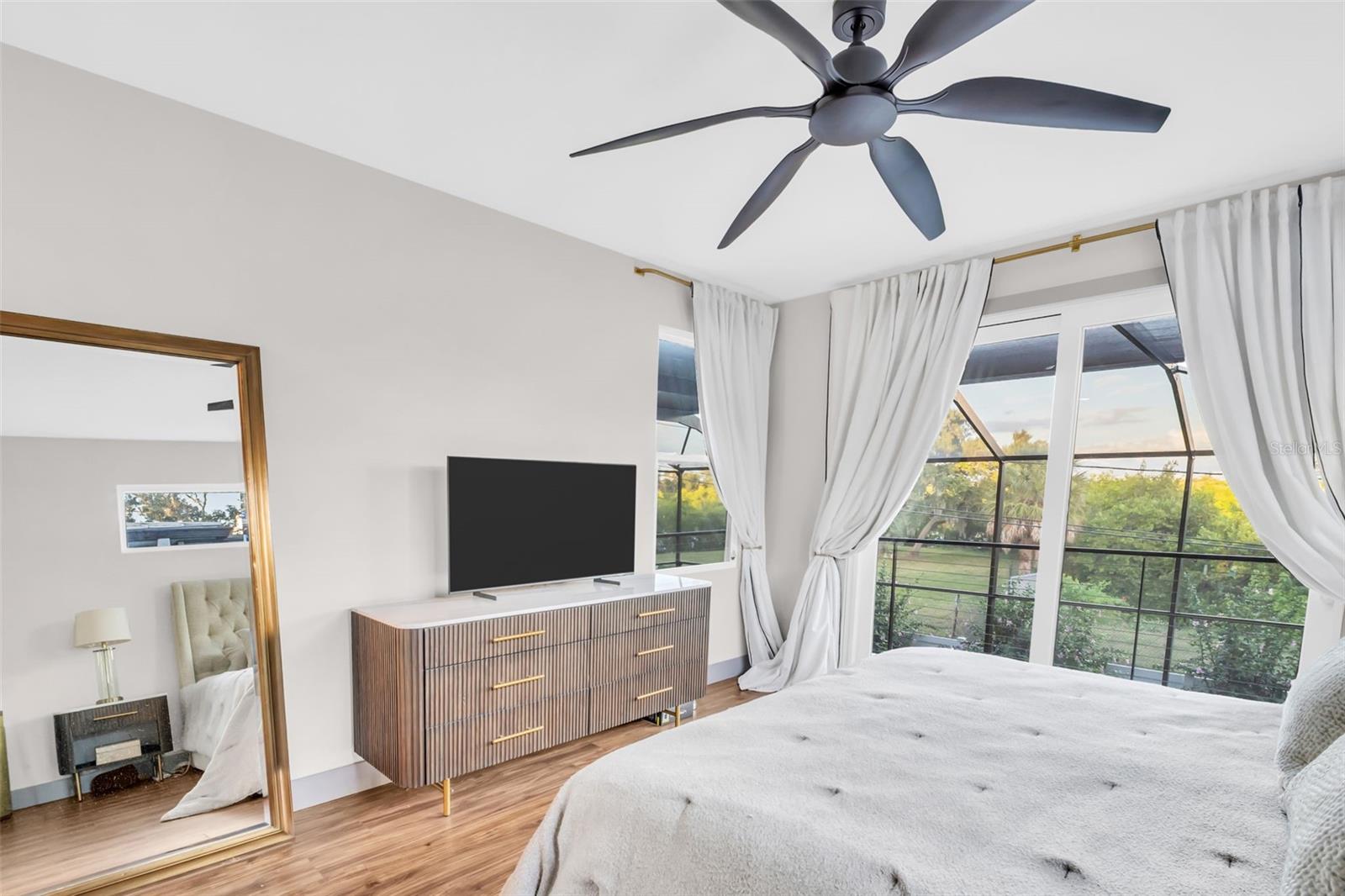 Primary bedroom with balcony