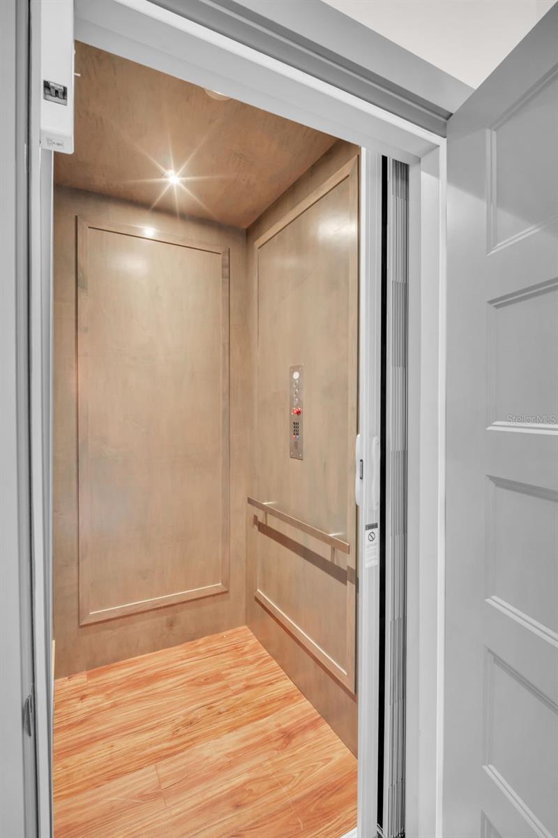 Custom elevator to all floors. No hauling groceries up stairs!
