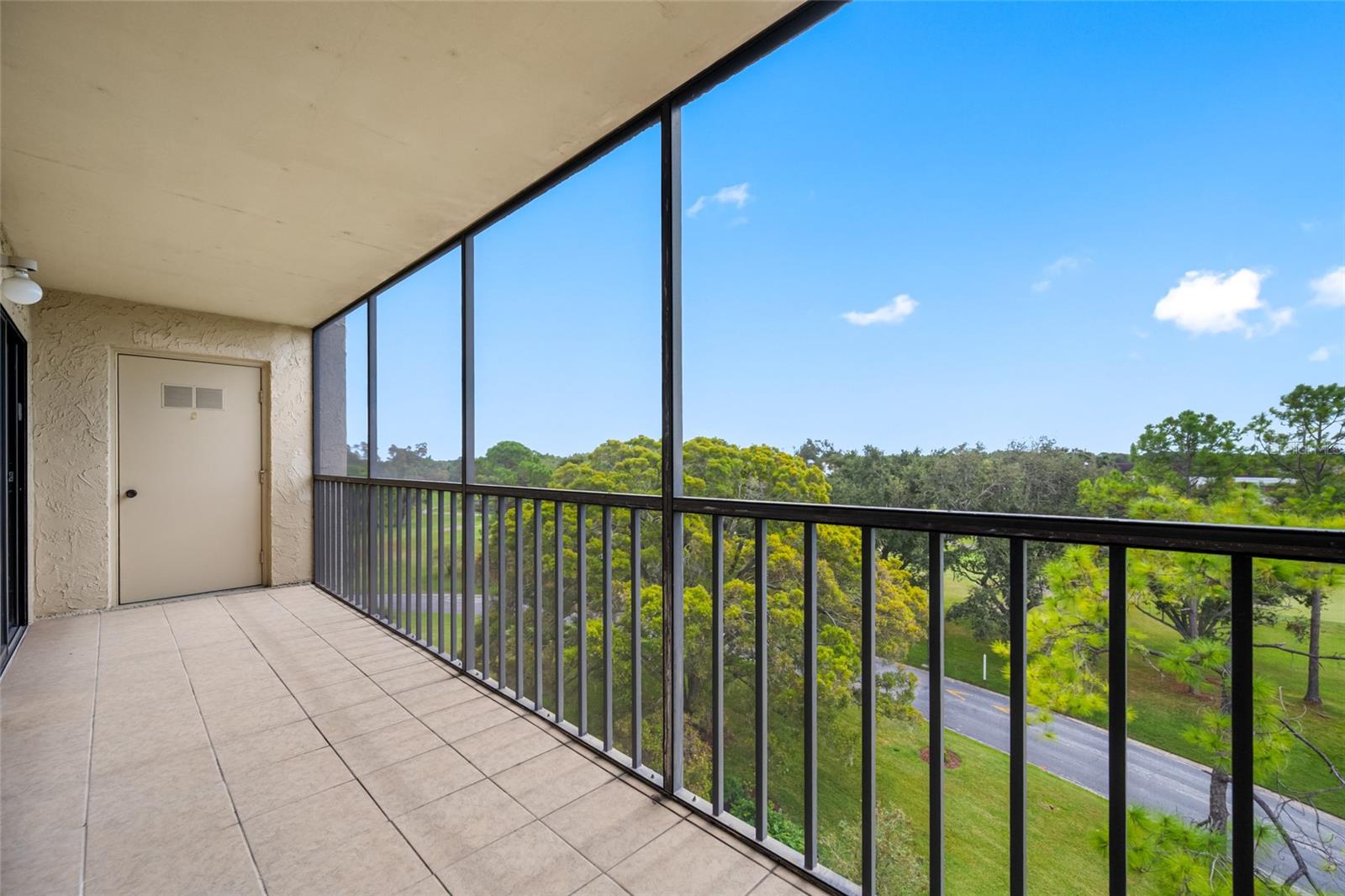 Lanai with laundry room located nearby to primary bedroom