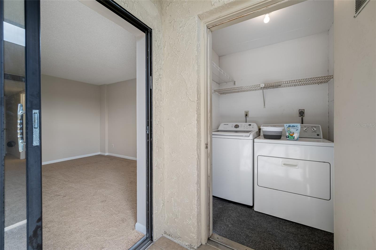 Laundry room with full size washer and dryer included.
