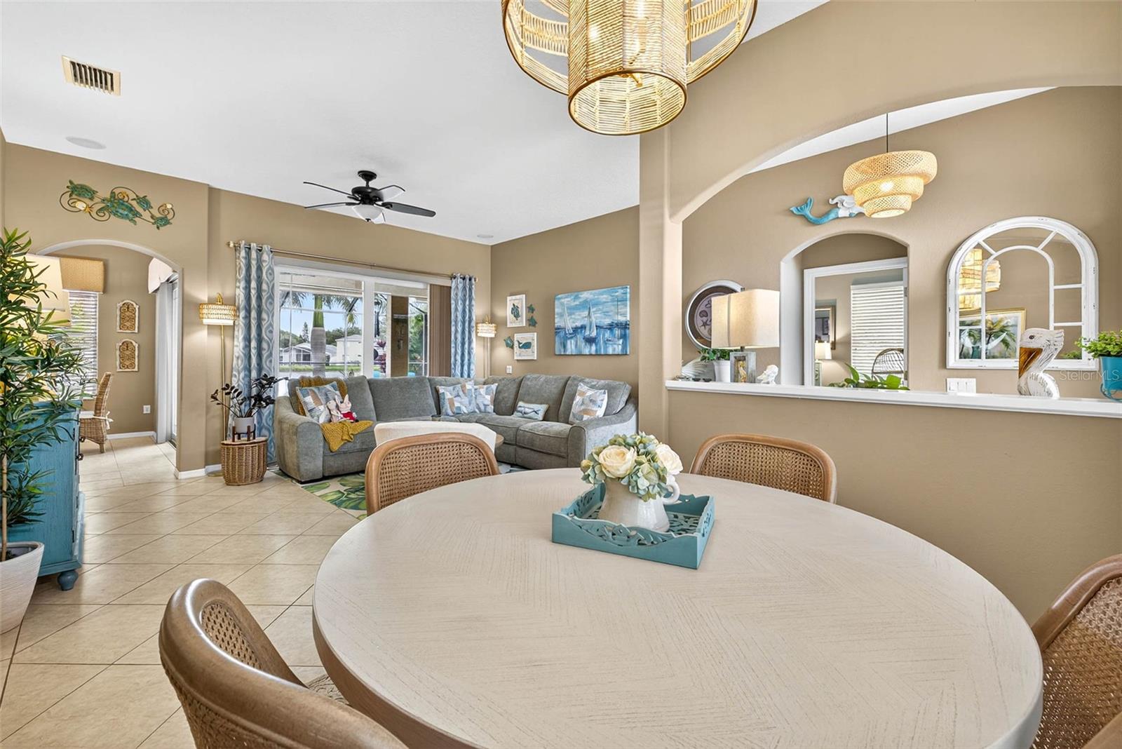 From Dining Room by Entry with Door to Primary Bedroom to Living Room with Breakfast Area in View