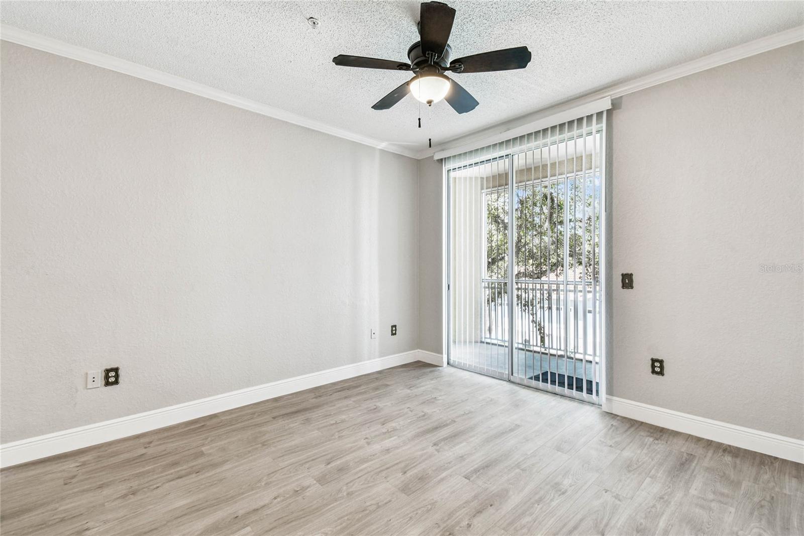 Living room w/ sliders to balcony