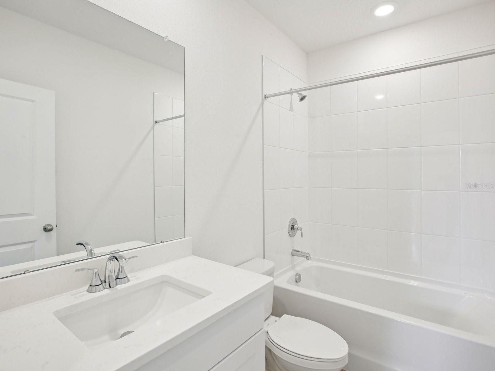 Photo is not of the actual home but of a builder home with same floorplan with similar interior finishes.