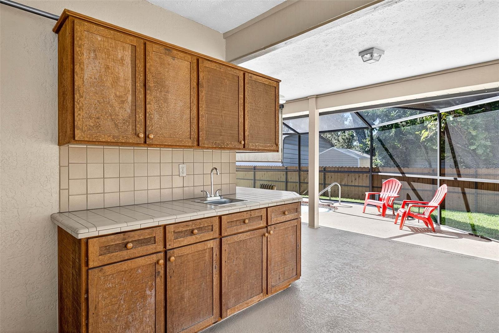 Screened lanai with storage and sink