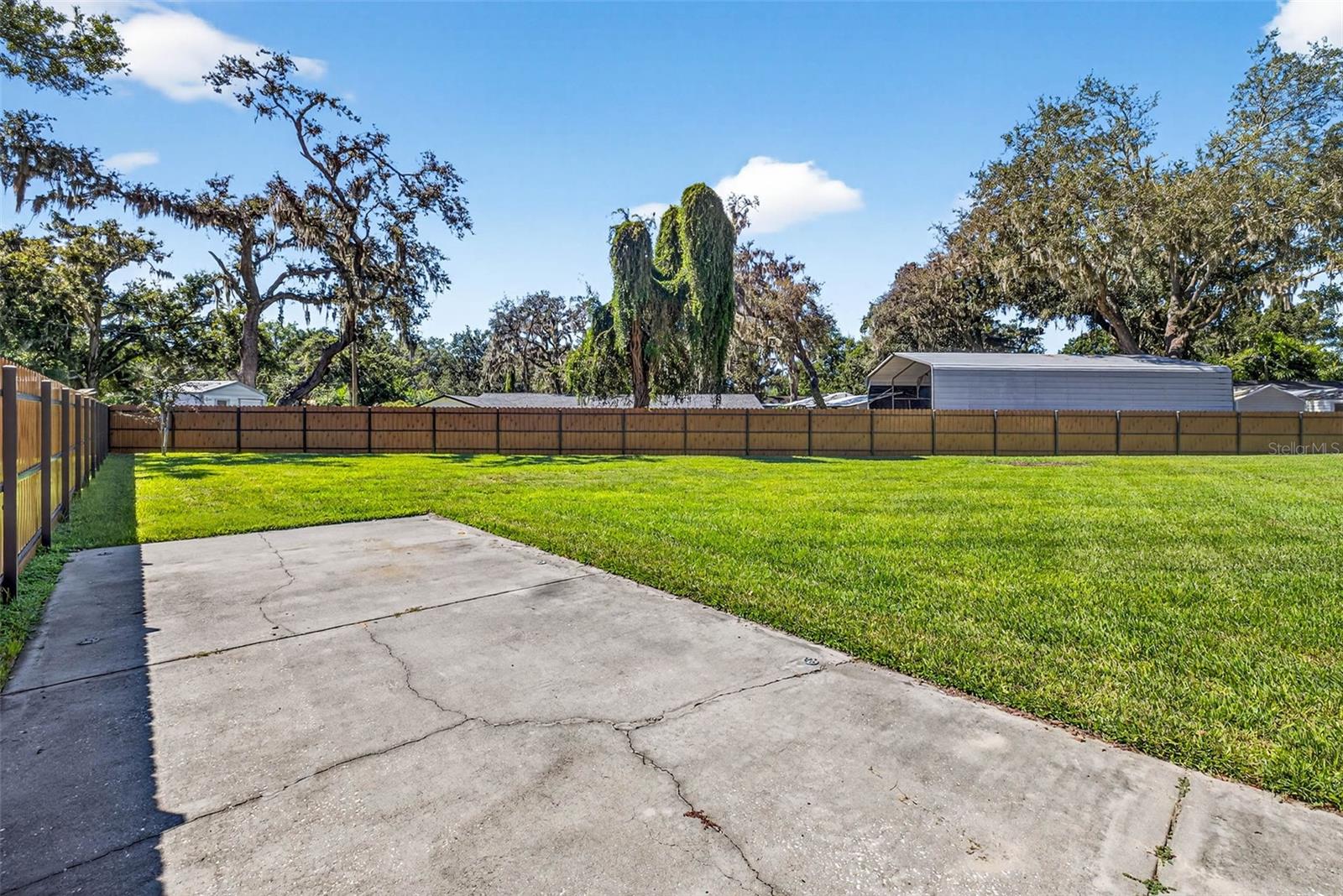Oversized garage with room for a boat or RV and parking pad for maneuvering