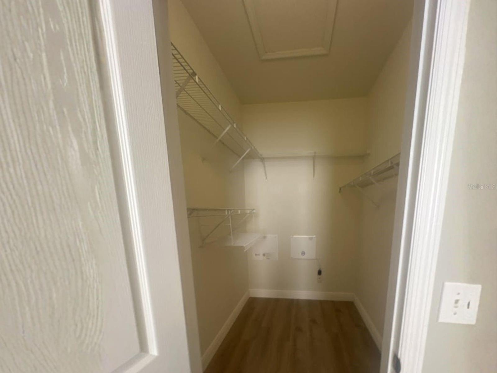 Plenty of Storage Room in the Primary Bedroom Closet-