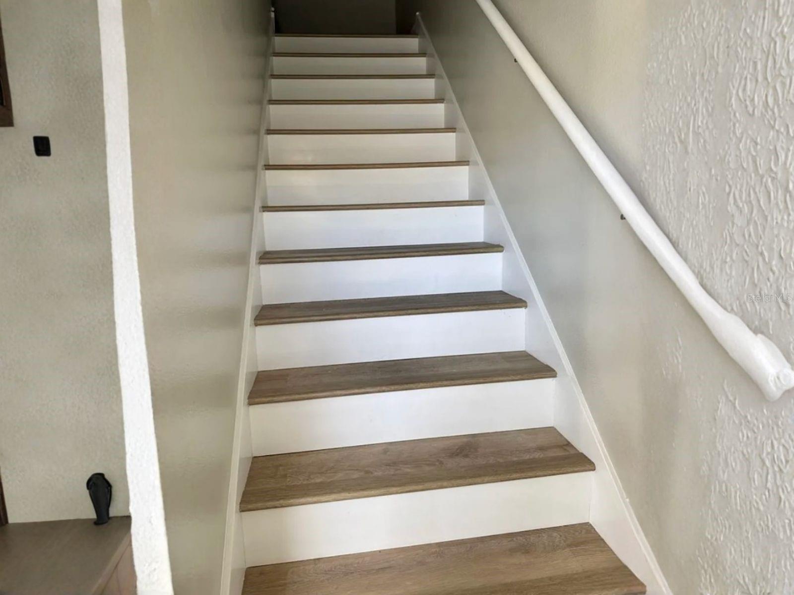 Flooring continues up the stairs