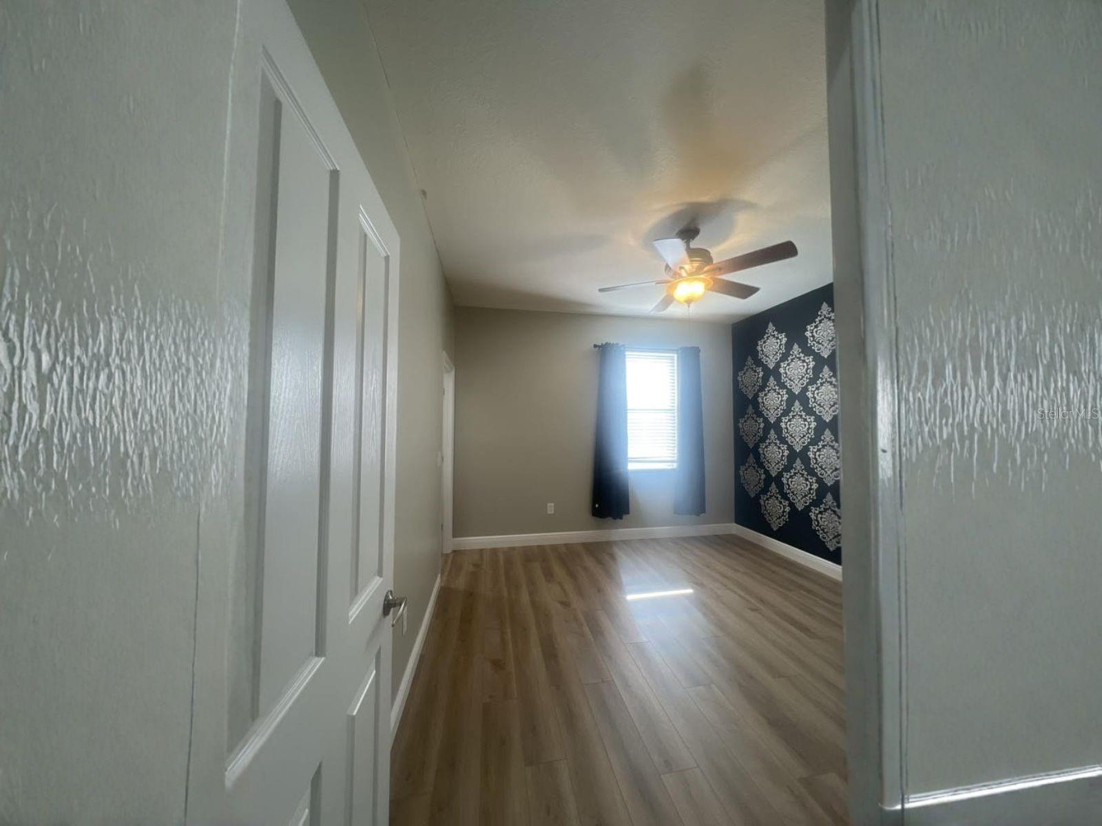 Looking Into Primary Bedroom with custom wall design(without furniture