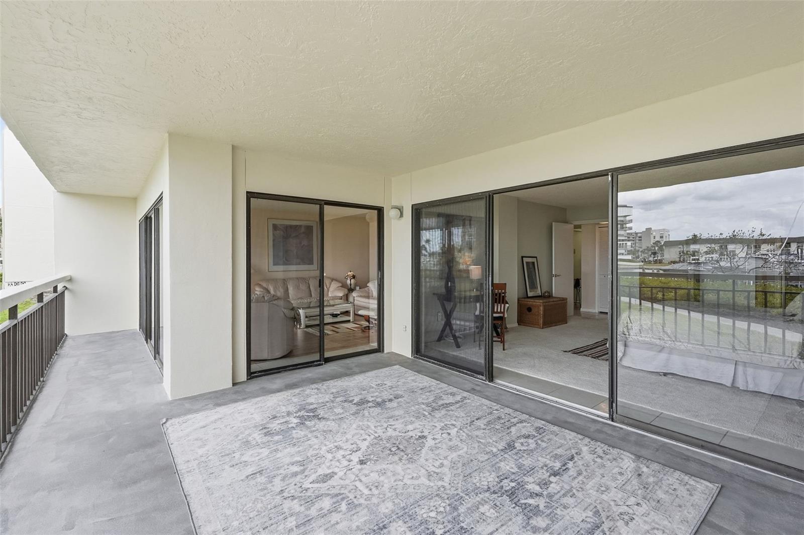 Open air patio can be enclosed with sliders