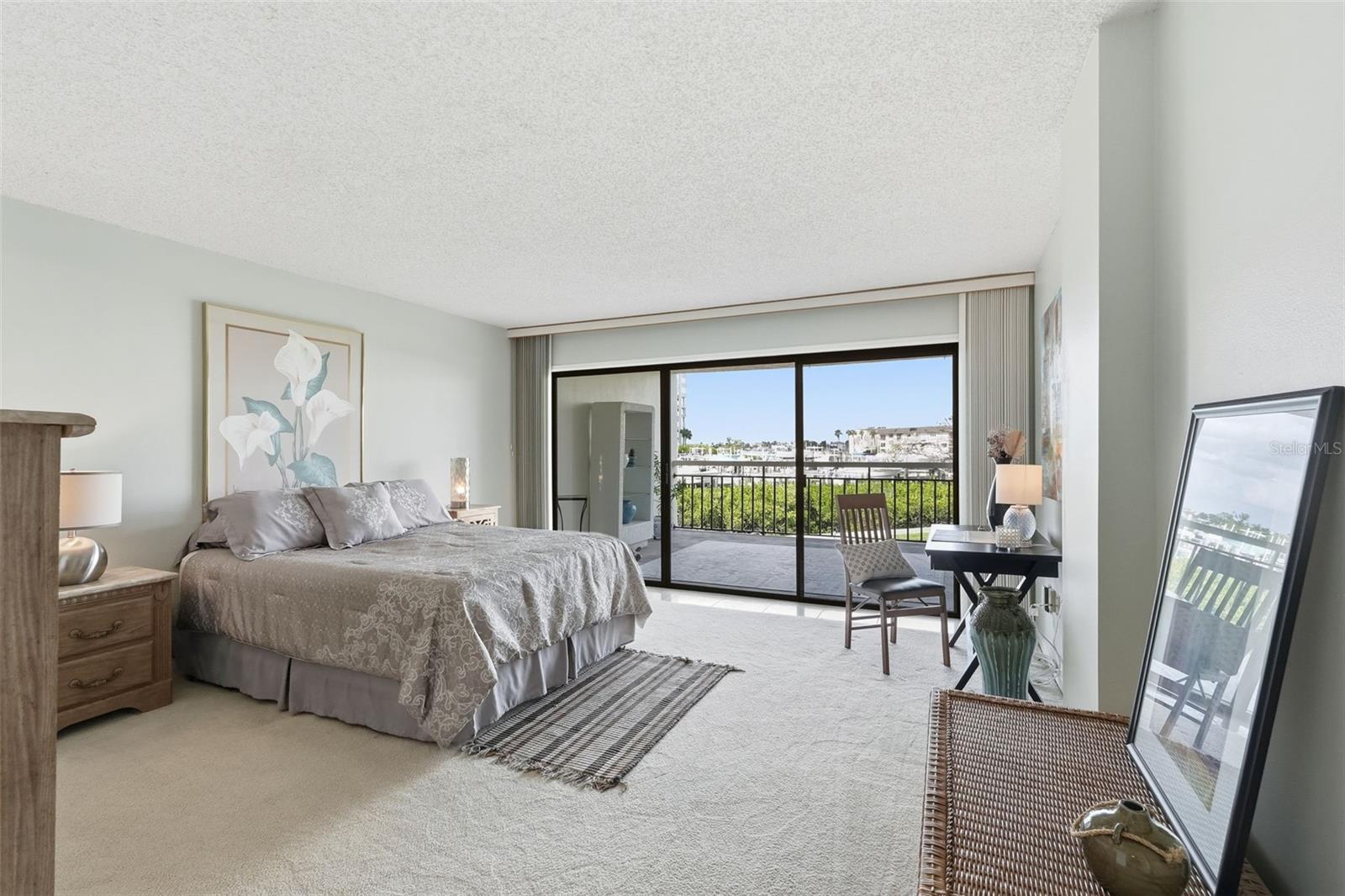 Bedroom with sliders to the patio.