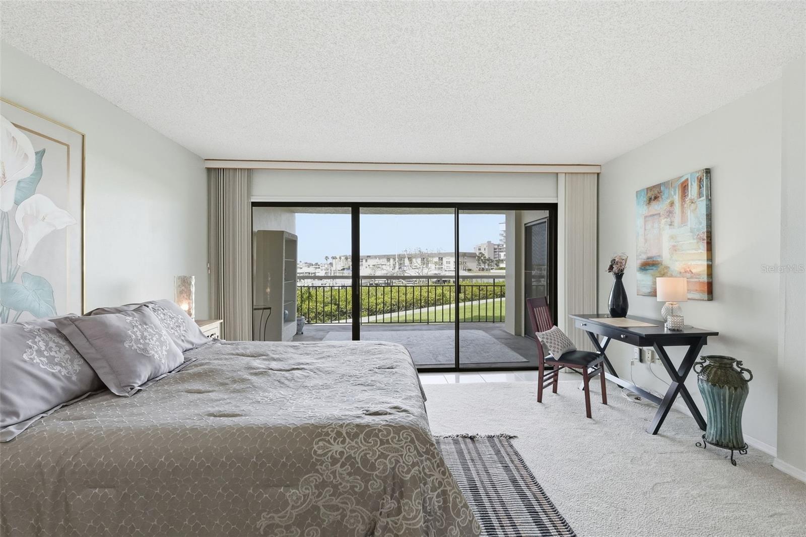 Bedroom with sliders to the patio.