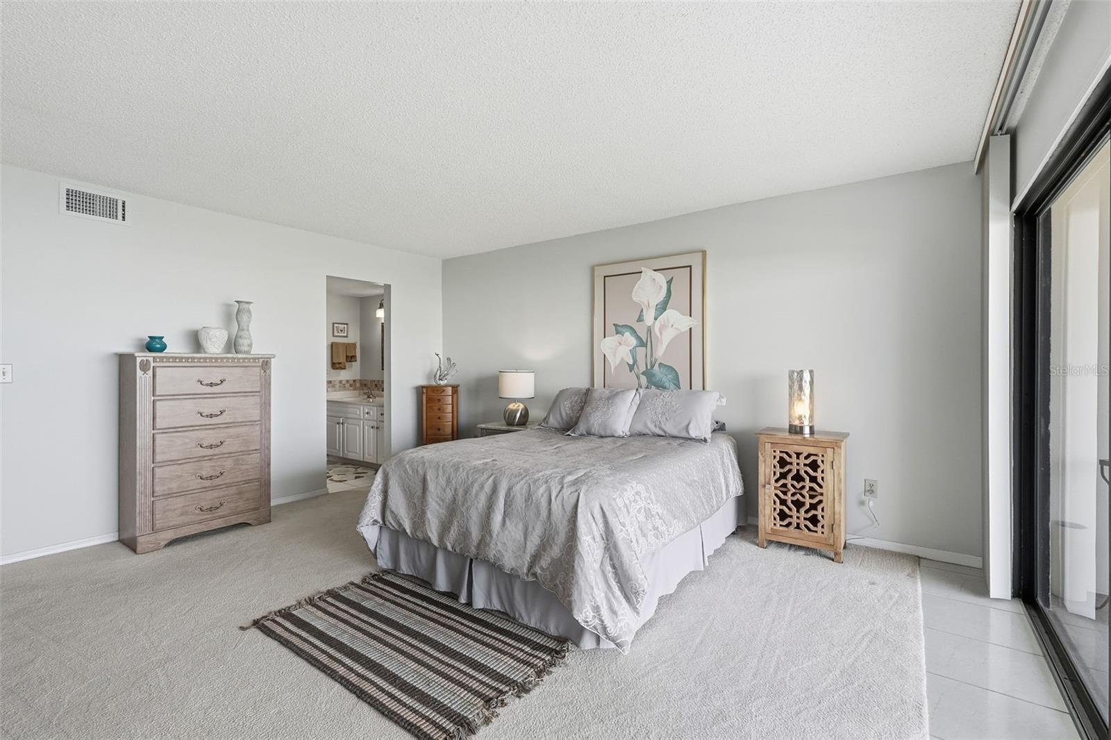 Bedroom with sliders to the patio.