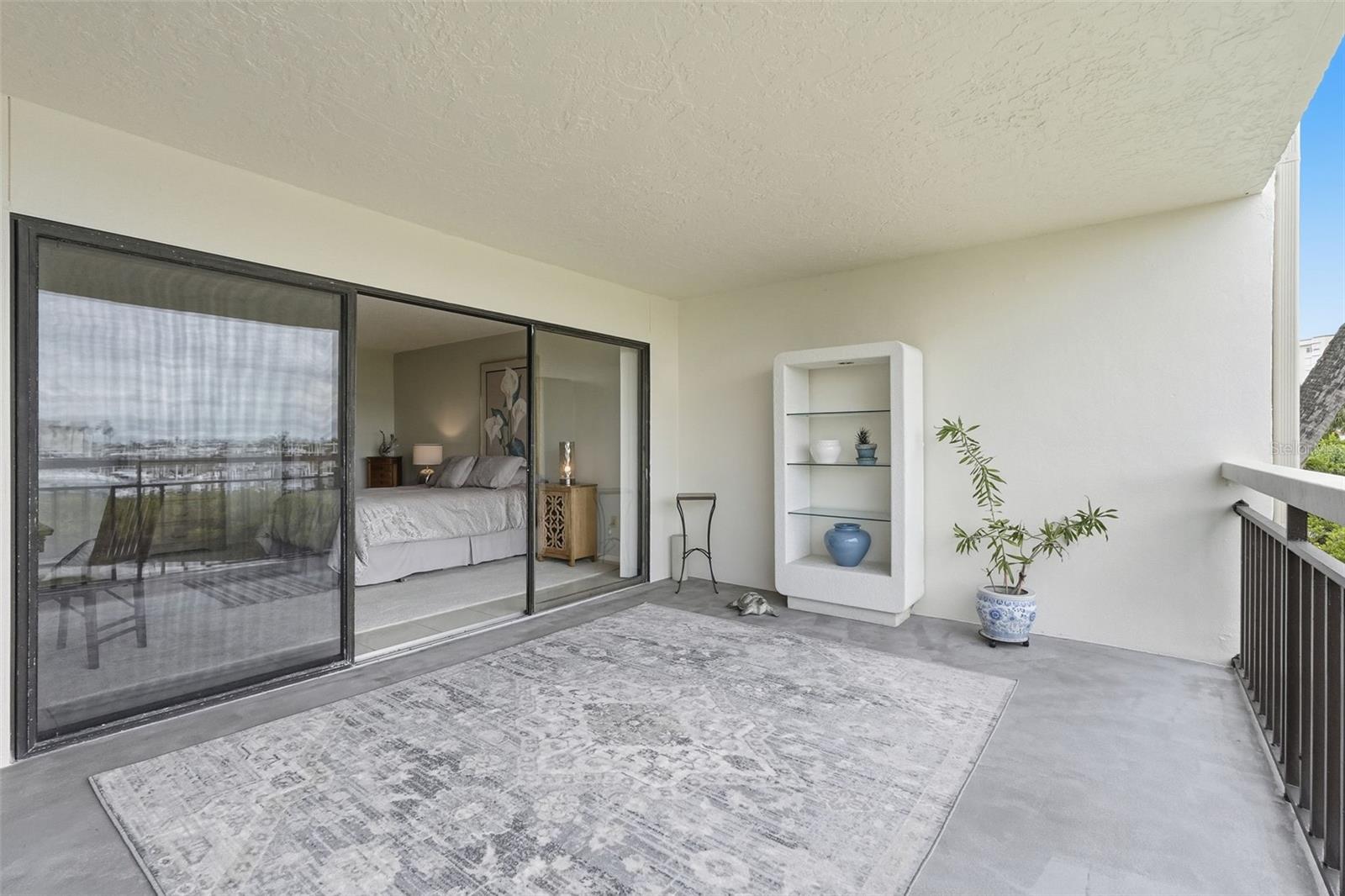 Open air patio can be enclosed with sliders