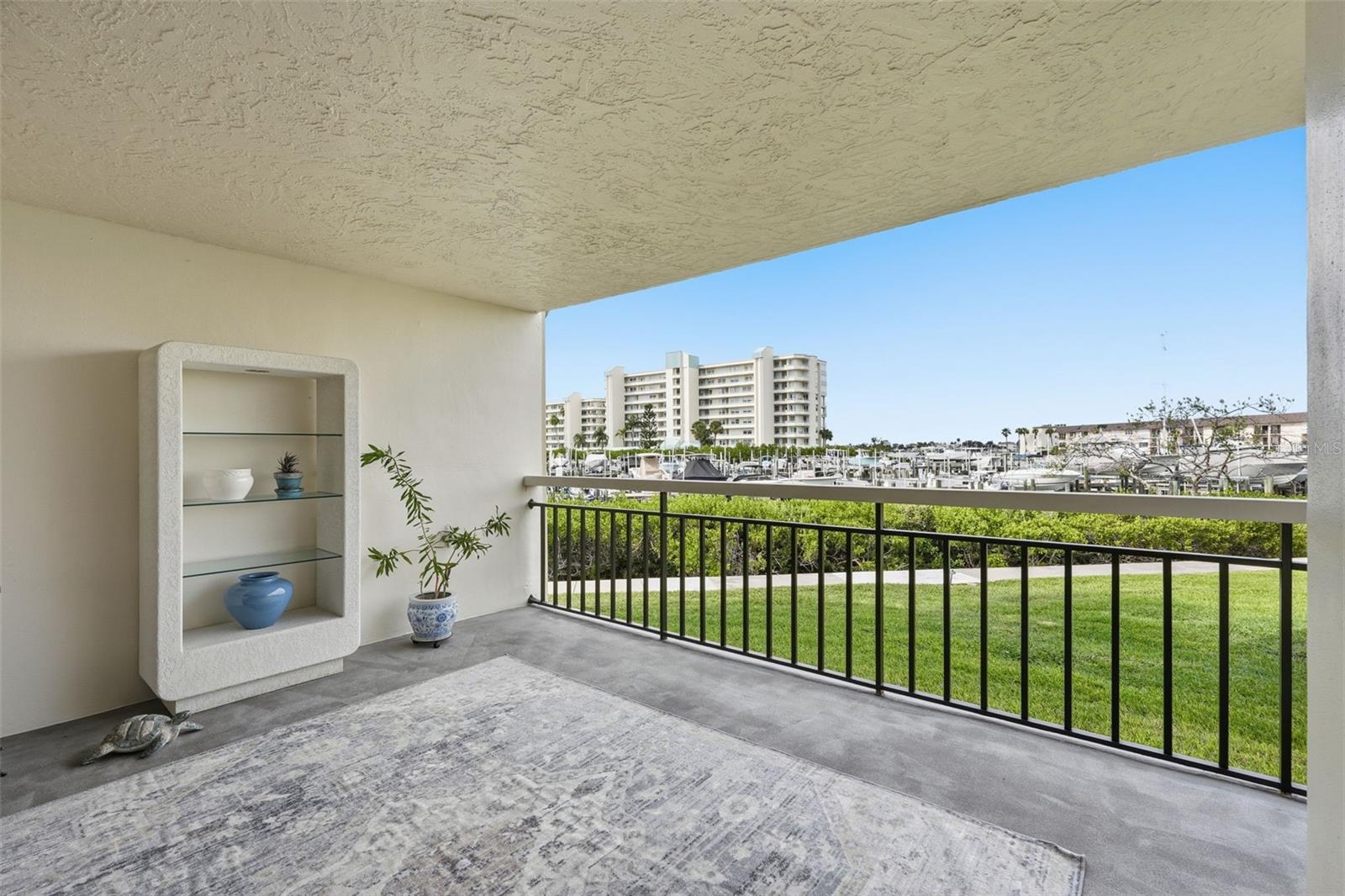 Open air patio can be enclosed with sliders to create a more versatile space.