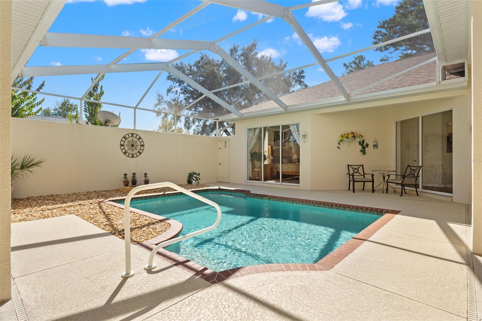 Screen enclosed courtyard with pool
