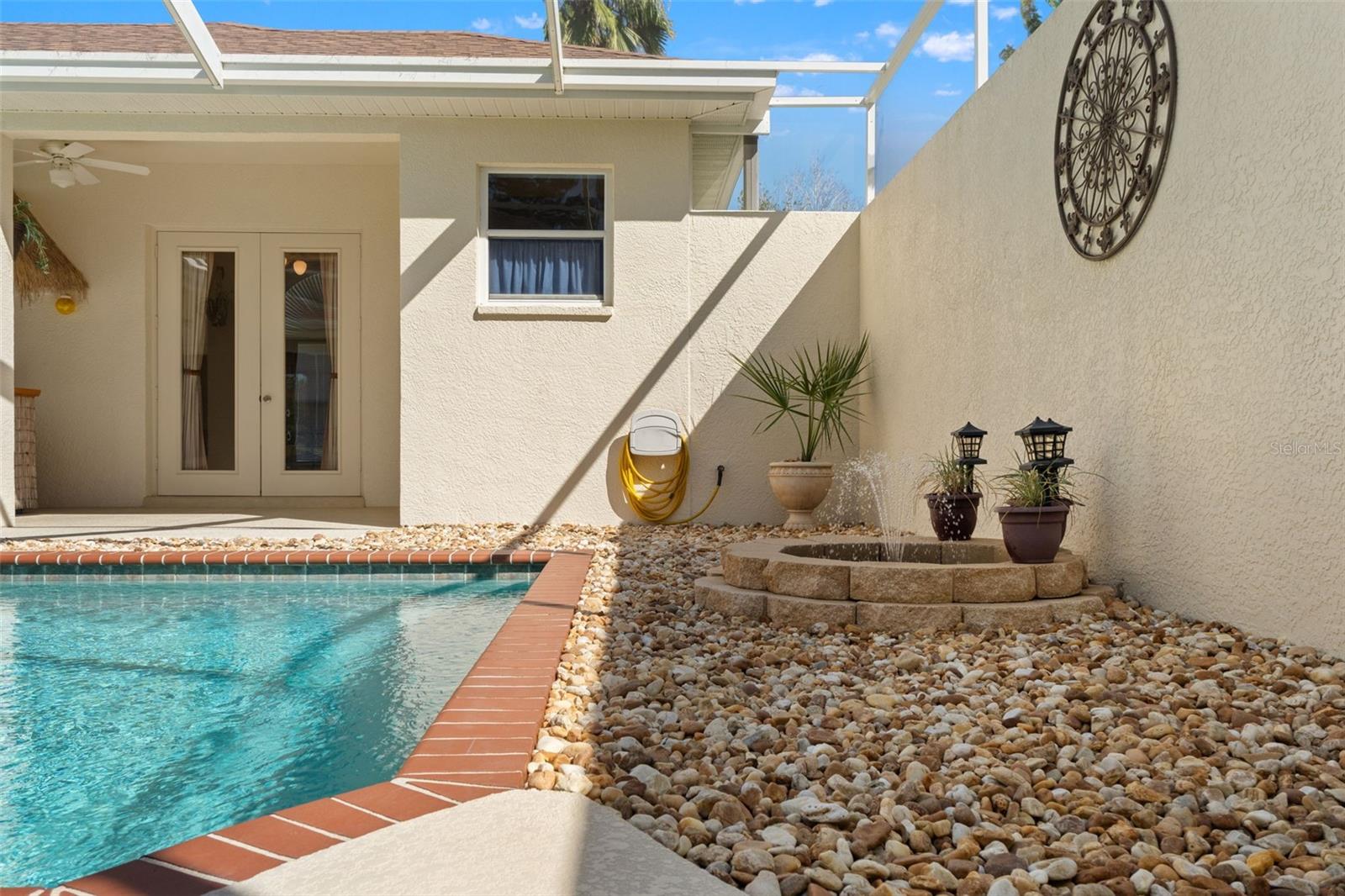 Screen enclosed courtyard with pool