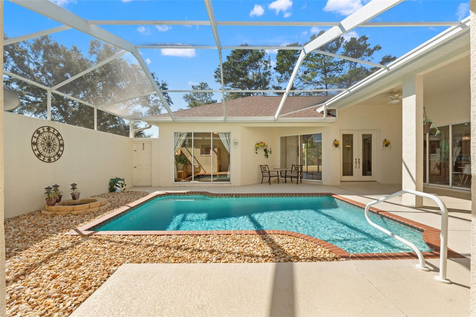 Screen enclosed courtyard with pool