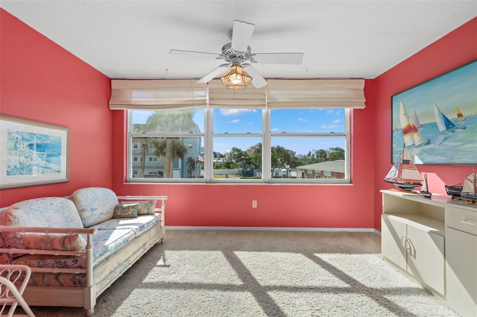 A versatile bonus sunroom provides additional living space; perfect for a home office, reading nook, art space, or a cozy lounge.