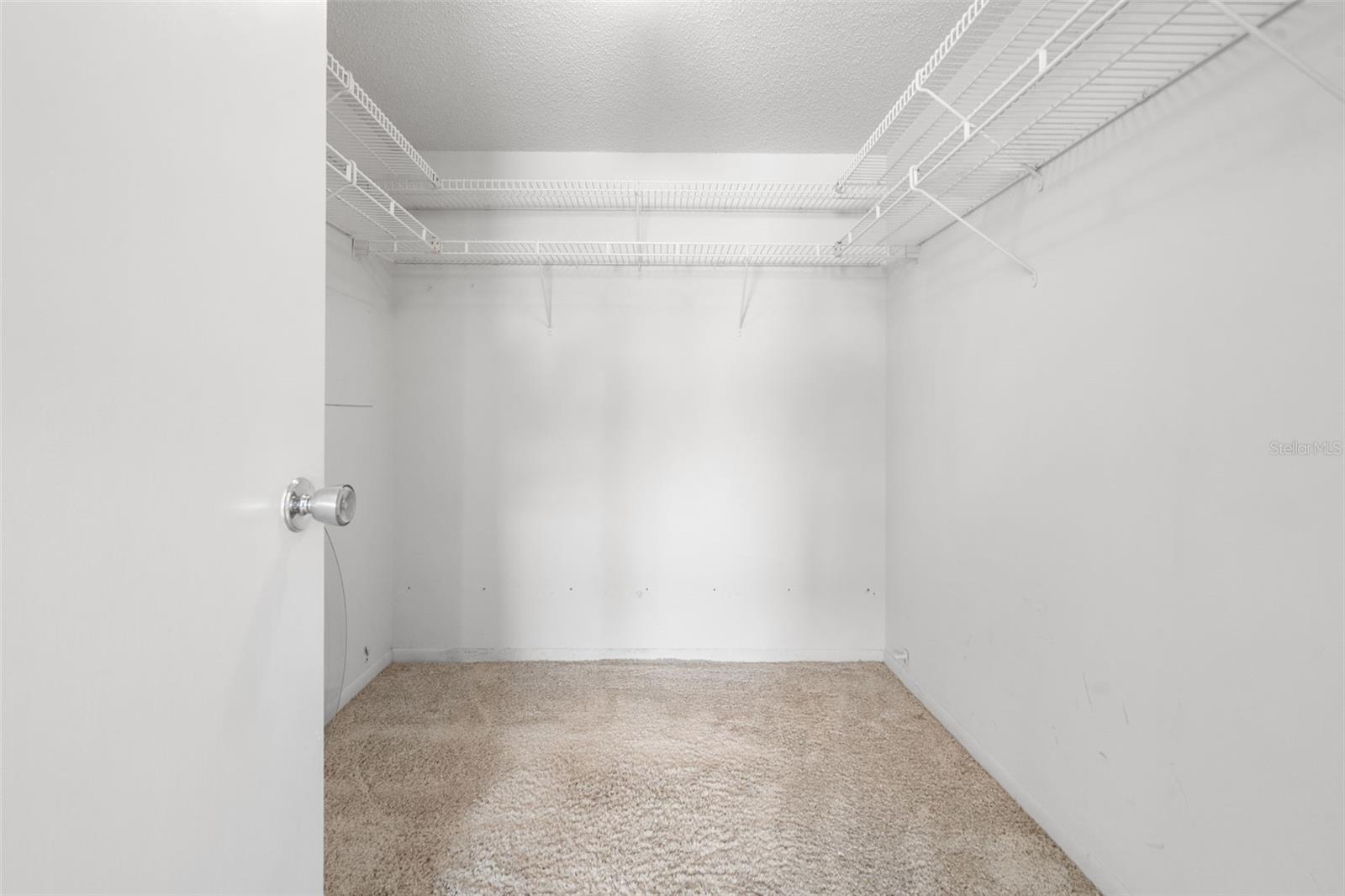 Primary walk-in closet.