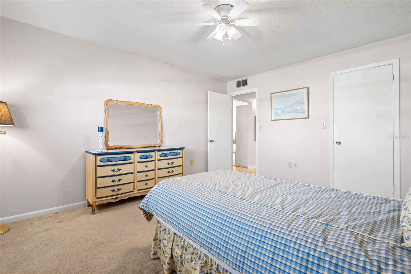 Guest bedroom with walk in closet.