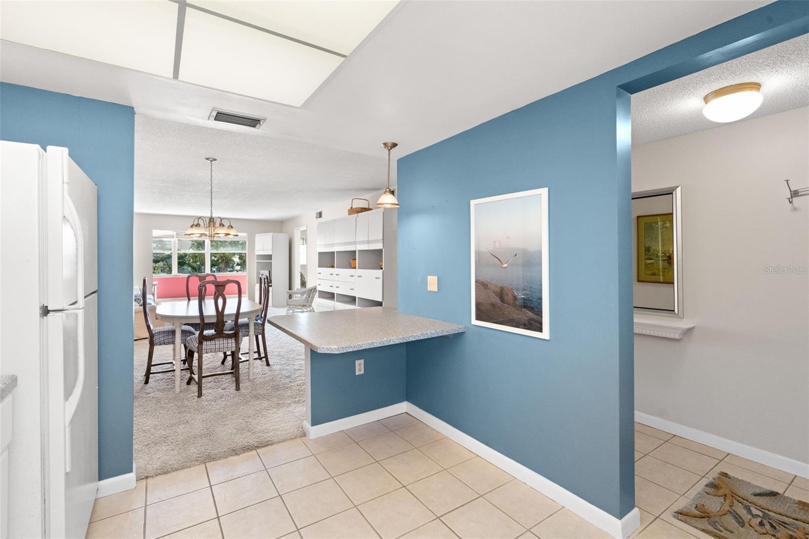 Kitchen and foyer entry.