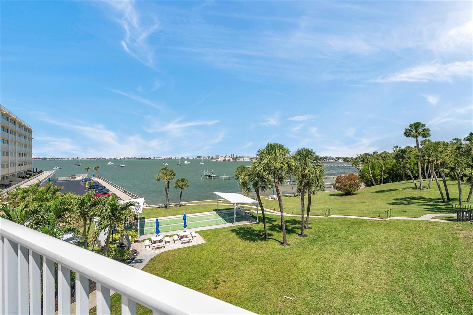private deck with water and pool view