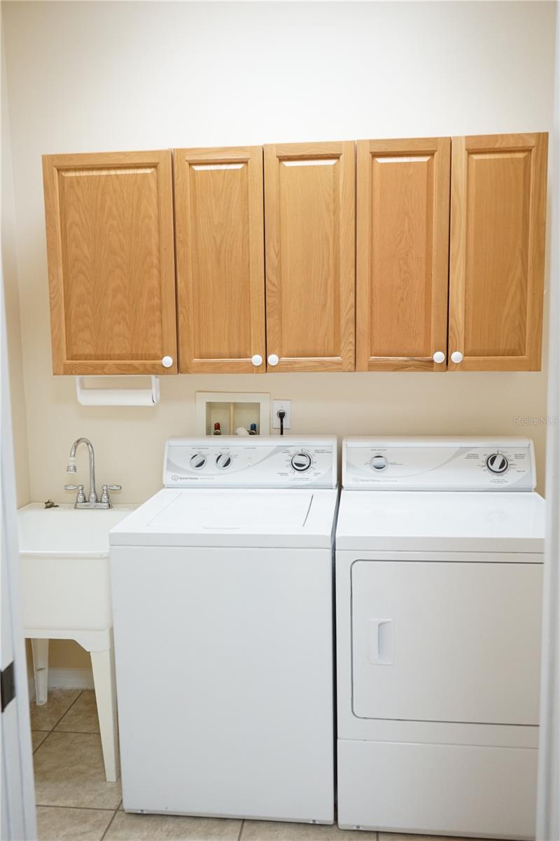 laundry has cabinets