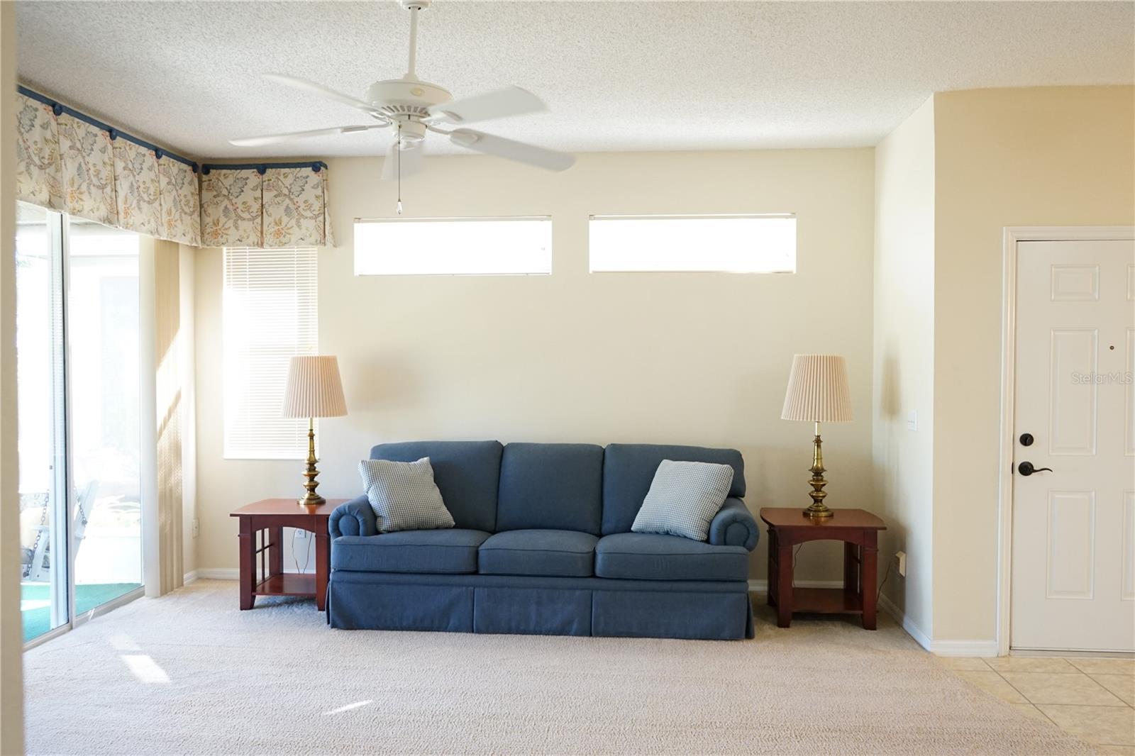 windows above couch provide lots of light