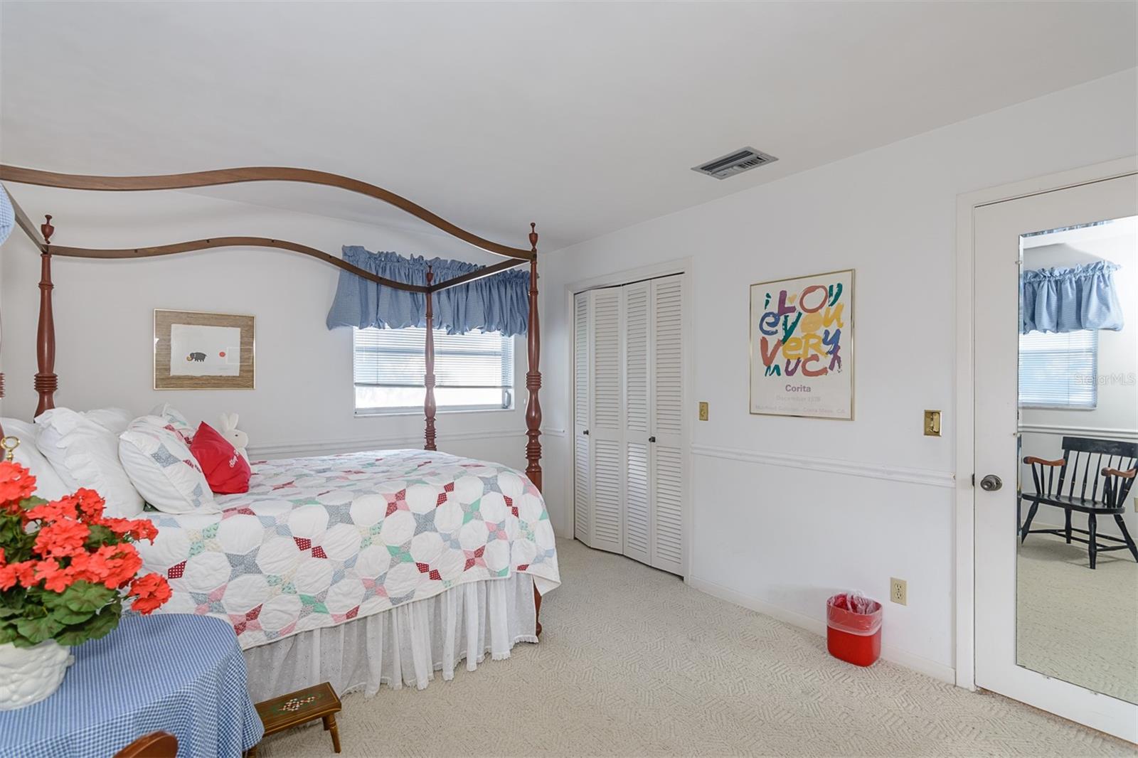 Bedroom 2 with sliding door to pool area