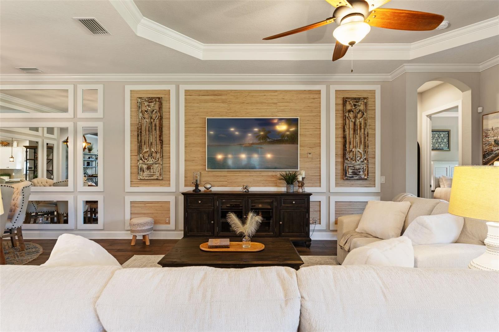 Entertainment wall with custom trim and neutral tones creating a sophisticated focal point.