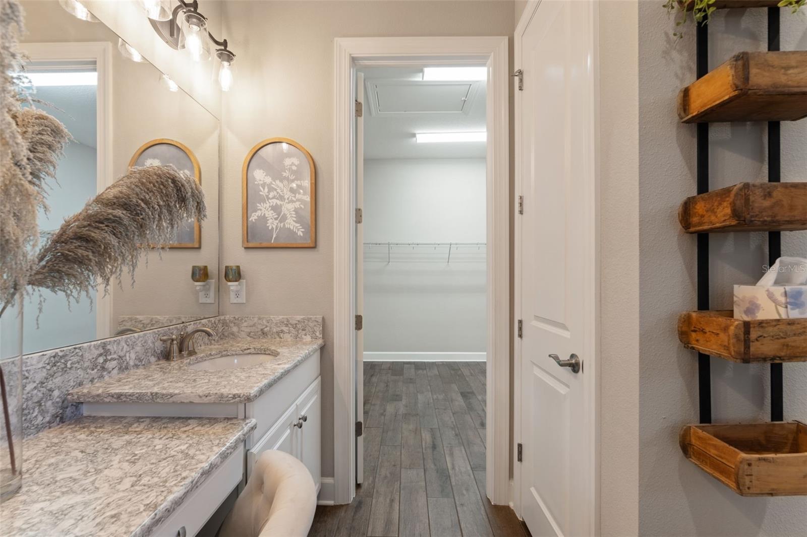 Direct access from the primary bathroom to the large walk-in closet, creating a seamless and functional layout.