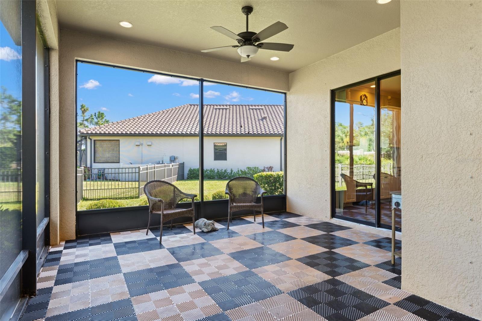 Inviting lanai setup that easily accommodates lounge seating and dining options, extending the home’s living space outdoors