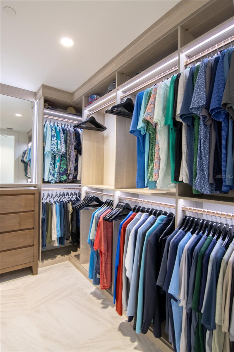 Primary Closet with California Closets Pietra Finish and Integrated Lighting