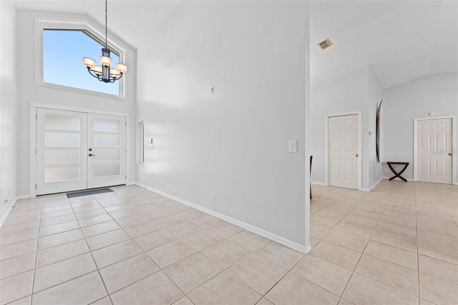 Spacious foyer that seamlessly leads into the main living areas, creating a warm and inviting flow throughout the home.