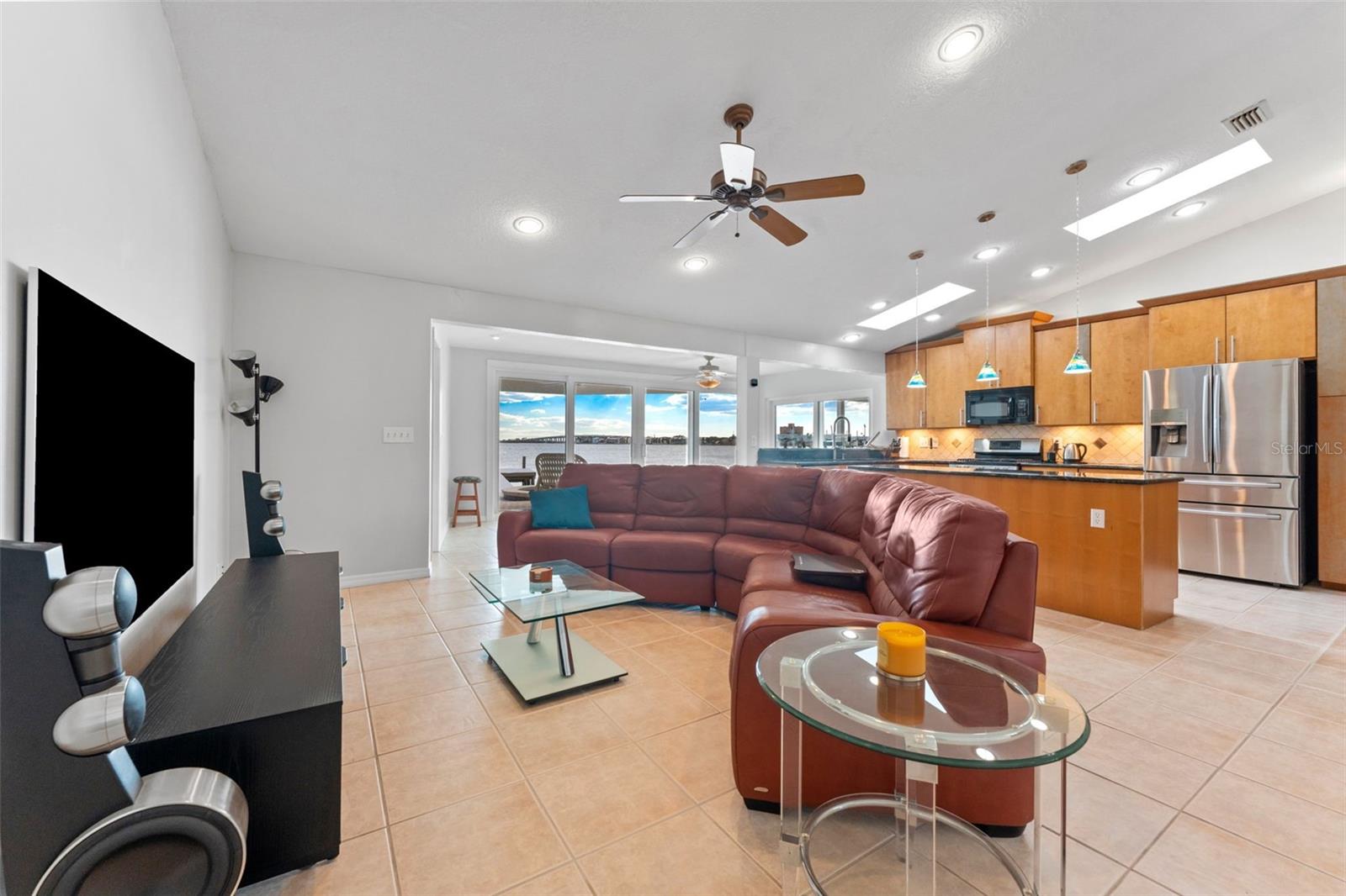 Open and inviting, this living room flows seamlessly into the modern kitchen, perfect for entertaining or relaxing with family.