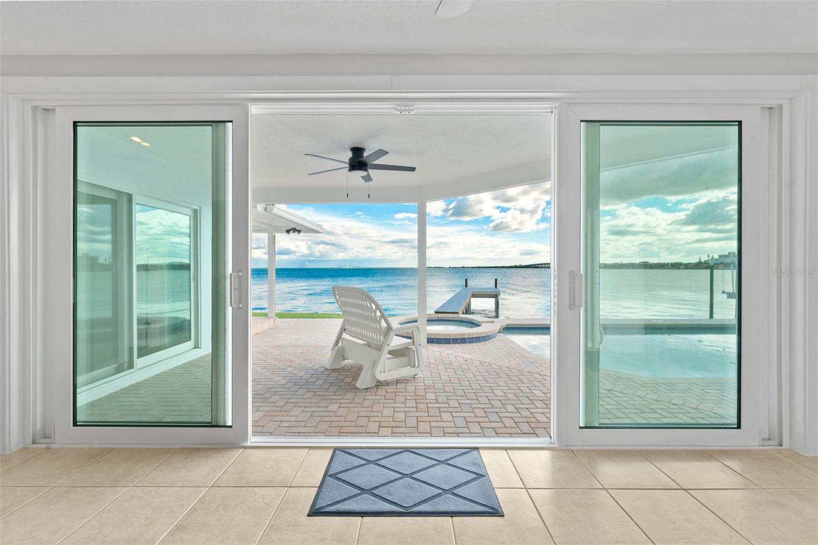 Step through these open sliding glass doors to the pool deck and soak in the breathtaking waterfront views.