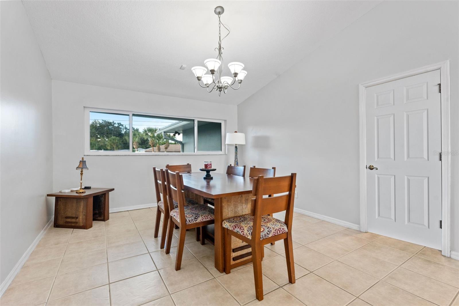 Spacious dining room with easy access to a walk-in pantry, perfect for hosting dinners and everyday meals.